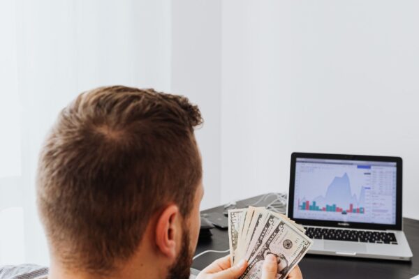 Entrepreneur using AI tools and digital platforms to make money online and build a self-employed business in 2026.